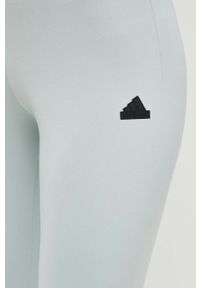 Adidas - adidas legginsy Z.N.E damskie kolor zielony gładkie. Stan: podwyższony. Kolor: zielony. Materiał: skóra, dzianina, materiał. Wzór: gładki. Sport: fitness #3