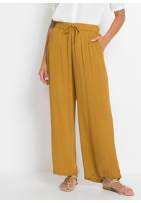 bonprix - Spodnie Marlena z lejącej wiskozy. Kolor: żółty. Materiał: wiskoza #1
