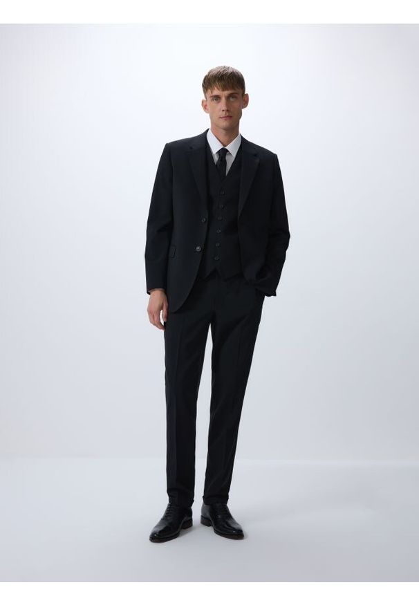 Reserved - Spodnie garniturowe z wełną - czarny. Kolor: czarny. Materiał: wełna