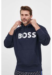 BOSS Orange - BOSS bluza bawełniana BOSS ORANGE męska kolor granatowy z kapturem z nadrukiem. Typ kołnierza: kaptur. Kolor: niebieski. Materiał: bawełna. Wzór: nadruk