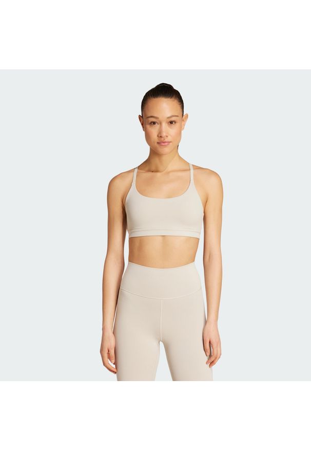 Adidas - Biustonosz adidas All Me Light Support. Kolor: beżowy. Sport: joga i pilates