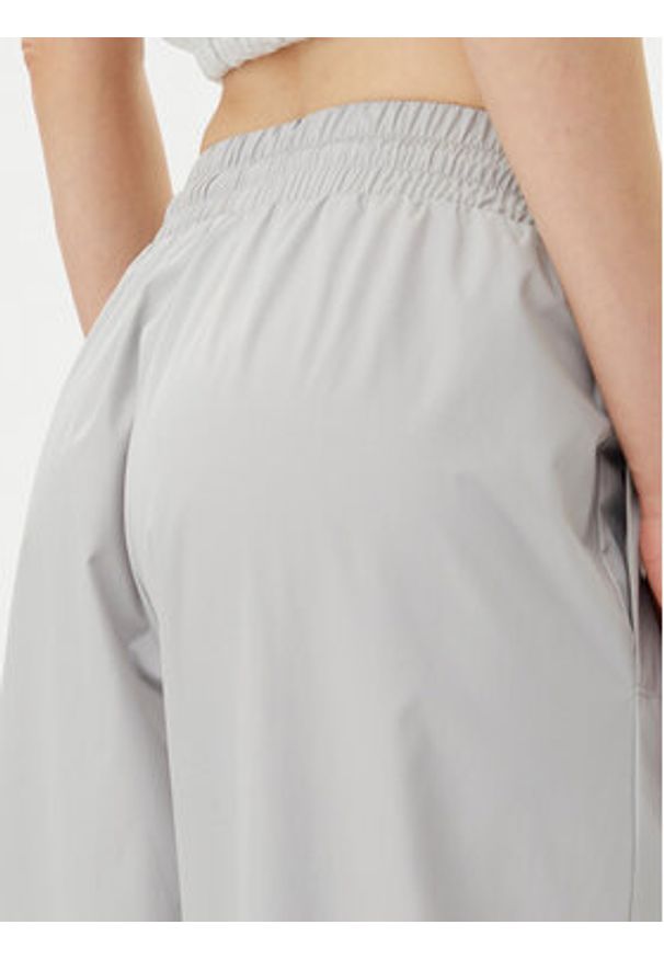 Adidas - adidas Spodnie dresowe Adibreak JJ3122 Szary Regular Fit. Kolor: szary. Materiał: syntetyk