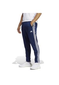 Adidas - Spodnie fitness męskie ADIDAS. Materiał: dresówka, materiał, skóra. Sport: fitness