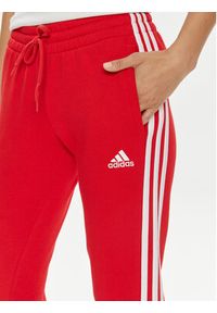 Adidas - adidas Spodnie dresowe Essentials 3-Stripes IY1719 Czerwony Slim Fit. Kolor: czerwony. Materiał: bawełna #3