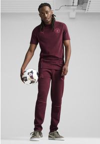 Puma - Męskie spodnie Casuals Manchester City PUMA Dark Jasper Dusty Orchid Red Purple. Kolor: czerwony, wielokolorowy, fioletowy. Materiał: dresówka