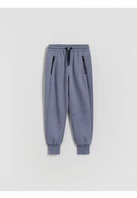 Reserved - Sportowe spodnie jogger - niebieski. Kolor: niebieski. Materiał: dzianina, bawełna. Styl: sportowy