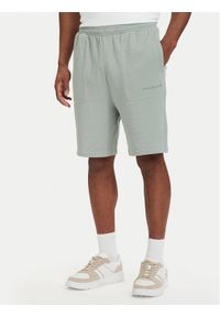TOMMY HILFIGER - Tommy Hilfiger Szorty sportowe Essential UM0UM03914 Zielony jasny Regular Fit. Kolor: zielony. Materiał: bawełna. Styl: sportowy #1