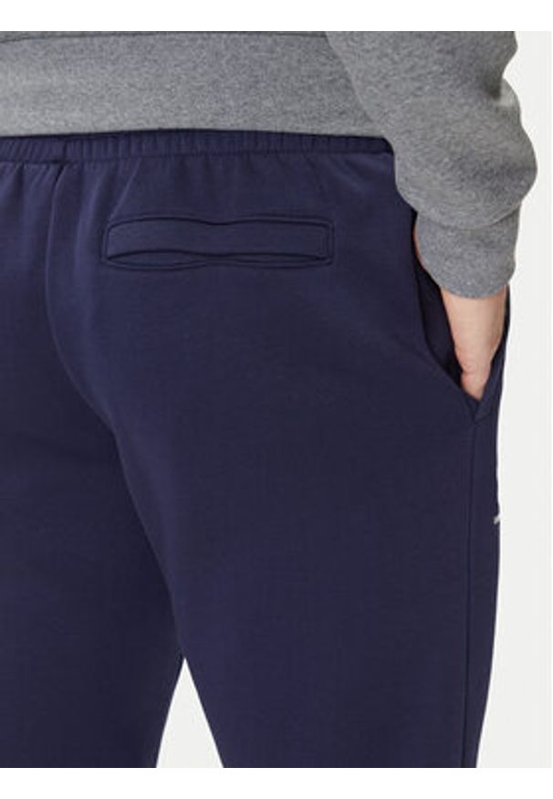Under Armour Spodnie dresowe UA Essential Fleece Jogger 1373882 Granatowy Regular Fit. Kolor: niebieski. Materiał: bawełna