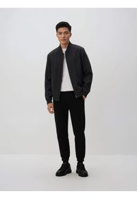 Reserved - Spodnie dresowe slim fit - czarny. Kolor: czarny. Materiał: dresówka #1