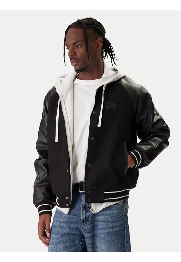 Tommy Jeans Kurtka bomber DM0DM22439 Czarny Regular Fit. Kolor: czarny. Materiał: syntetyk