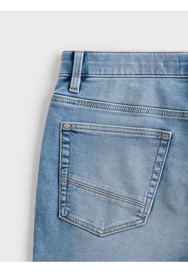 Reserved - Jeansy slim z efektem sprania - niebieski. Kolor: niebieski