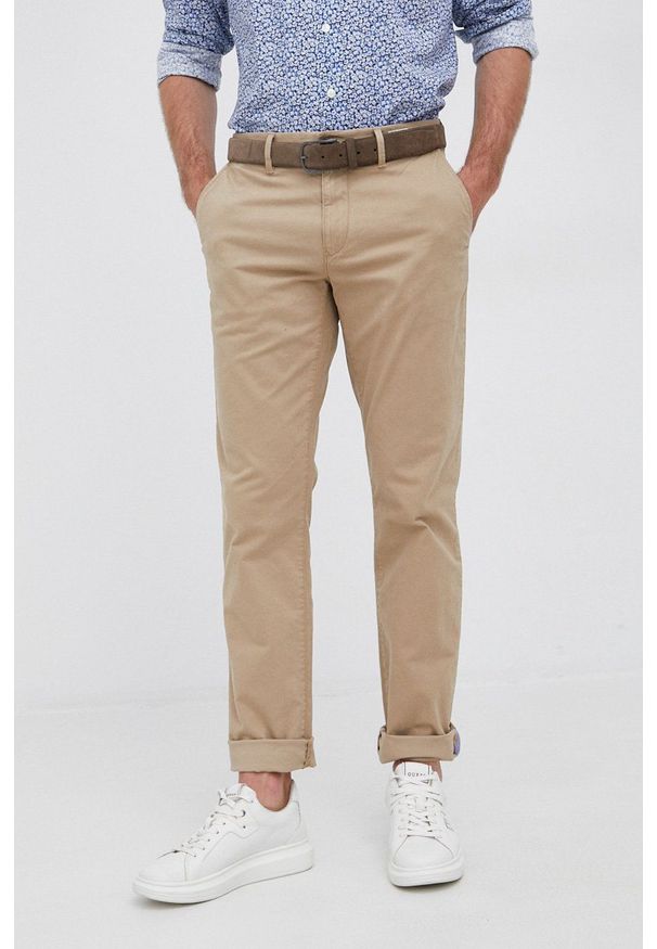 TOMMY HILFIGER - Tommy Hilfiger spodnie męskie kolor granatowy w fasonie chinos. Okazja: na co dzień. Kolor: niebieski. Materiał: tkanina. Wzór: gładki. Styl: casual