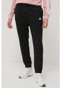 Adidas - adidas spodnie HE1794 męskie kolor czarny melanżowe. Kolor: czarny. Materiał: dzianina, materiał. Wzór: melanż