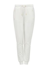 Ochnik - Kremowe dresowe spodnie damskie. Kolor: biały. Materiał: bawełna