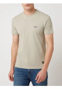 Beżowy t-shirt z nadrukiem na piersi Aeronautica Militare. Kolor: beżowy. Materiał: bawełna. Wzór: nadruk