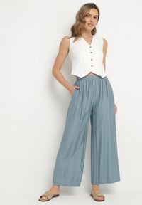 Born2be - Jasnoniebieskie Szerokie Spodnie Typu Palazzo z Wysokim Stanem Varlevi. Okazja: na co dzień. Stan: podwyższony. Kolor: niebieski. Styl: elegancki, casual #7