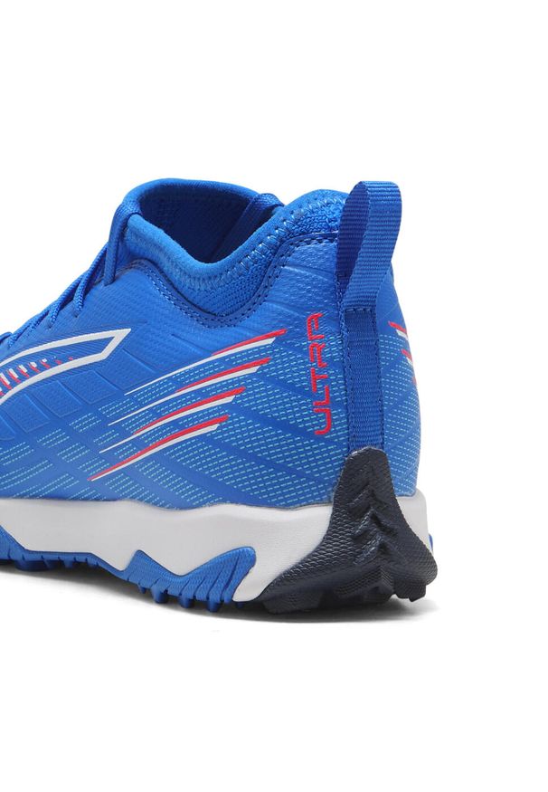 Puma - Młodzieżowe buty piłkarskie ULTRA 6 MATCH TT Mid PUMA. Kolor: czerwony, niebieski, wielokolorowy, biały. Szerokość cholewki: normalna. Sport: piłka nożna