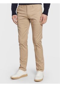 TOMMY HILFIGER - Tommy Hilfiger Chinosy Core Bleecker MW0MW28883 Beżowy Slim Fit. Kolor: beżowy. Materiał: bawełna