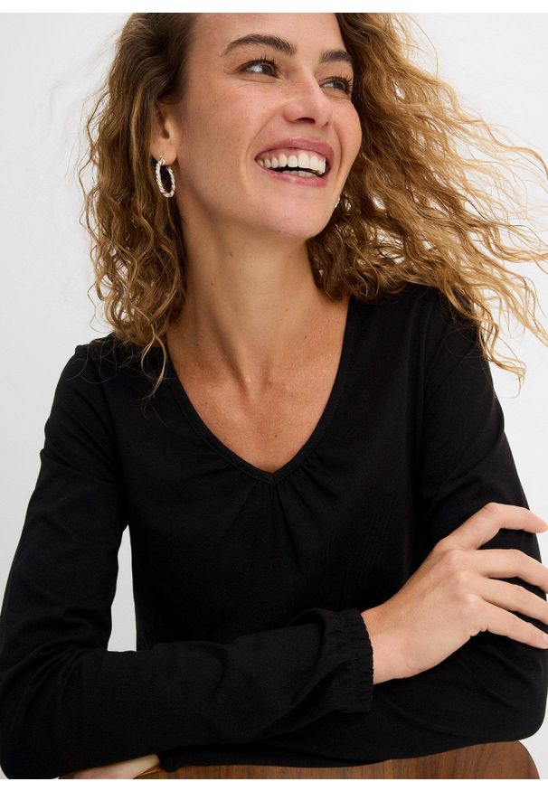 bonprix - Bluzka bawełniana z czystej bawełny z długim rękawem i gumką. Typ kołnierza: dekolt w serek. Kolor: czarny. Materiał: bawełna. Długość rękawa: długi rękaw. Długość: długie