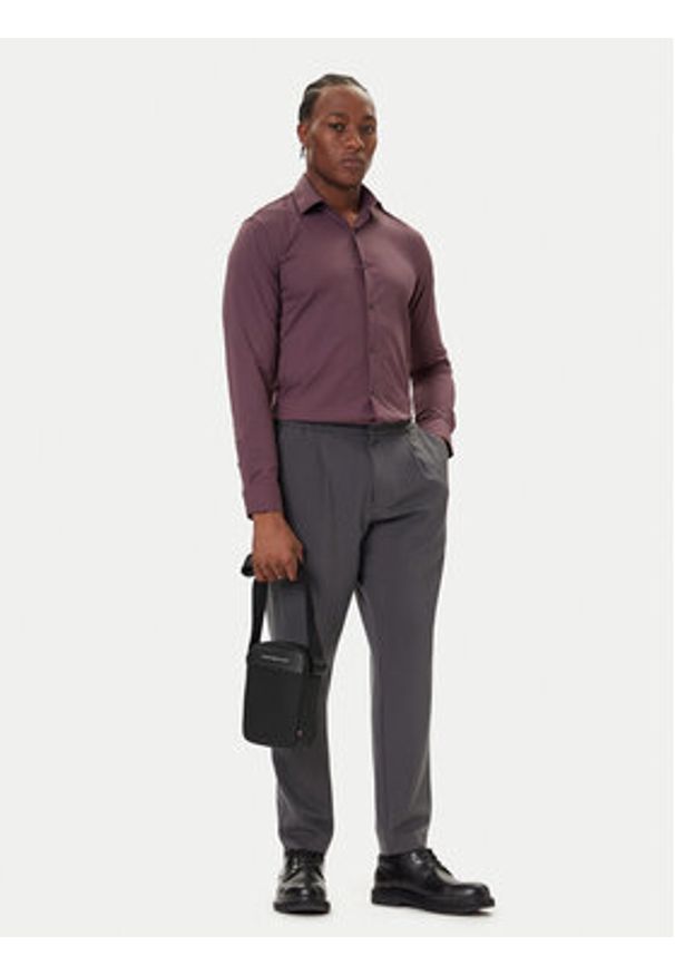 TOMMY HILFIGER - Tommy Hilfiger Saszetka Th Foundation Mini Reporter AM0AM13624 Czarny. Kolor: czarny. Materiał: skóra