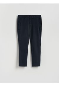 Reserved - Spodnie chino slim fit - granatowy. Kolor: niebieski. Materiał: tkanina, bawełna