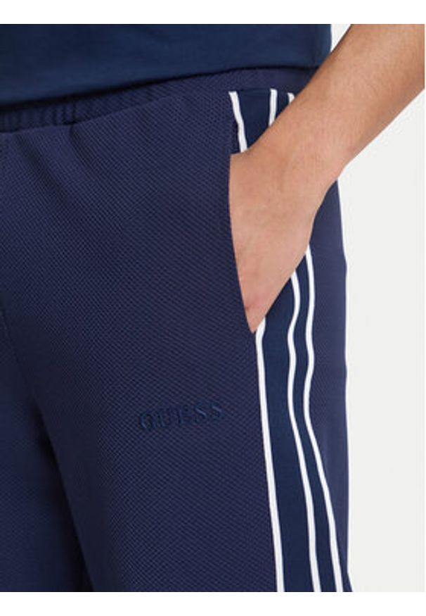 Guess Spodnie dresowe Z6GB11 K3202 Granatowy Regular Fit. Kolor: niebieski. Materiał: syntetyk