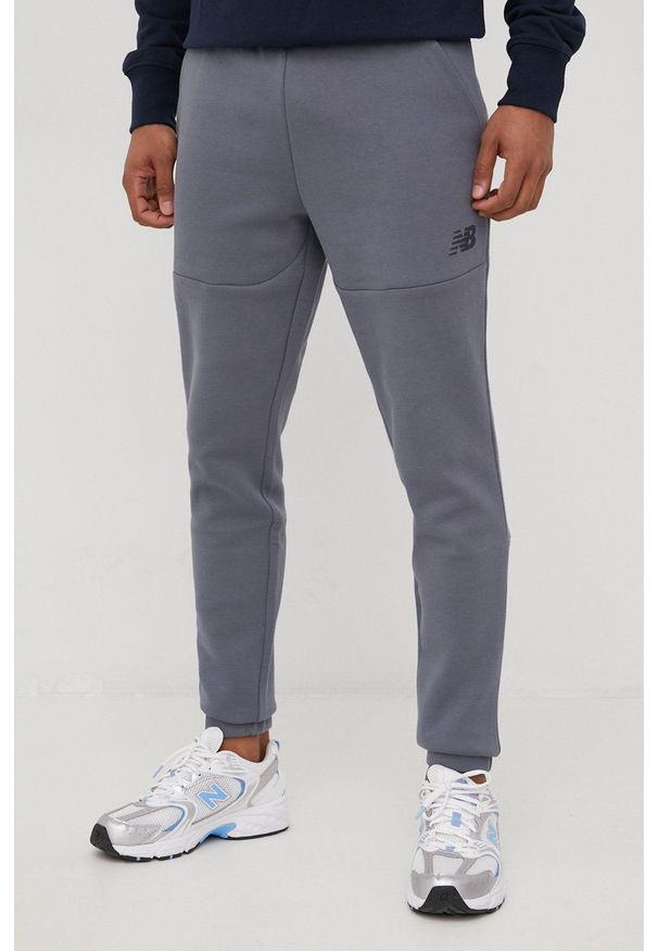 New Balance spodnie dresowe MP21143LED męskie kolor szary gładkie. Kolor: szary. Materiał: dresówka. Wzór: gładki