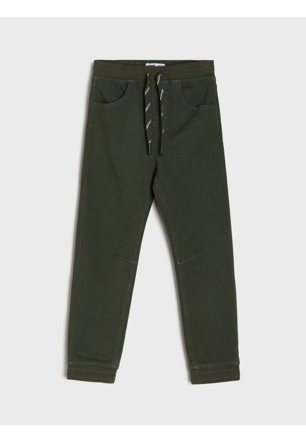 Sinsay - Jeansy jogger z efektem sprania - zielony. Kolor: zielony