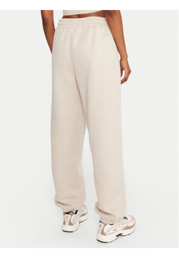 Reebok Spodnie dresowe Reebok X Ewa Chodakowska RK25304CCW Beżowy Regular Fit. Kolor: beżowy. Materiał: bawełna