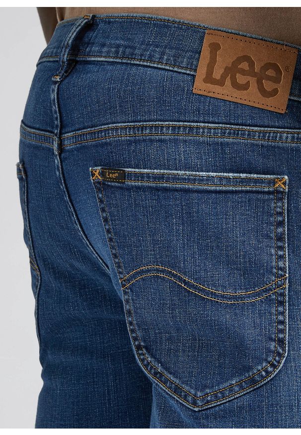 Lee - LEE DAREN ZIP FLY MĘSKIE SPODNIE JEANSOWE MID WORN KAHUNA L707NLC07 112328504