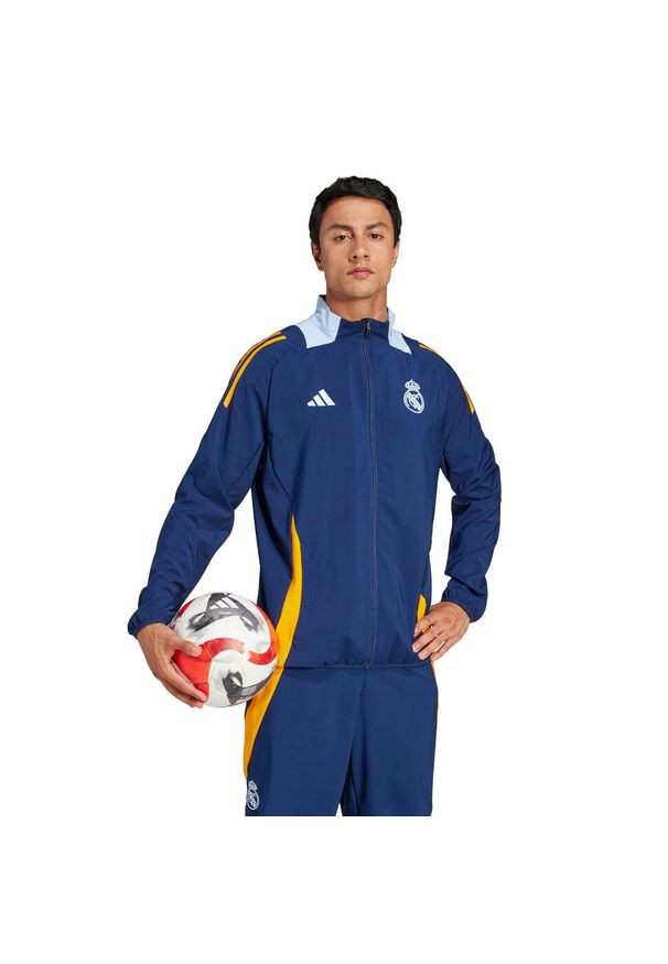 Adidas - Kurtka prezentacyjna Real Madrid 2024/25. Kolor: niebieski, pomarańczowy, wielokolorowy. Sport: piłka nożna