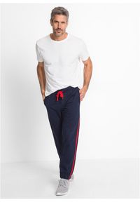 bonprix - Spodnie sportowe z kontrastowymi elementami. Kolor: niebieski. Materiał: dresówka. Styl: sportowy #3