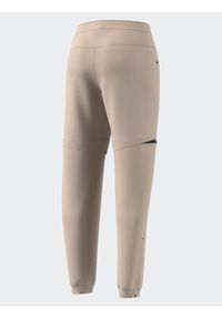 Adidas - adidas Spodnie dresowe Terrex Utilitas Hiking Zip-Off Tracksuit Bottoms HZ9046 Beżowy Regular Fit. Kolor: beżowy. Materiał: syntetyk #6