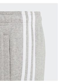 Adidas - adidas Spodnie dresowe Essentials 3-Stripes IC6127 Szary Slim Fit. Kolor: szary. Materiał: bawełna
