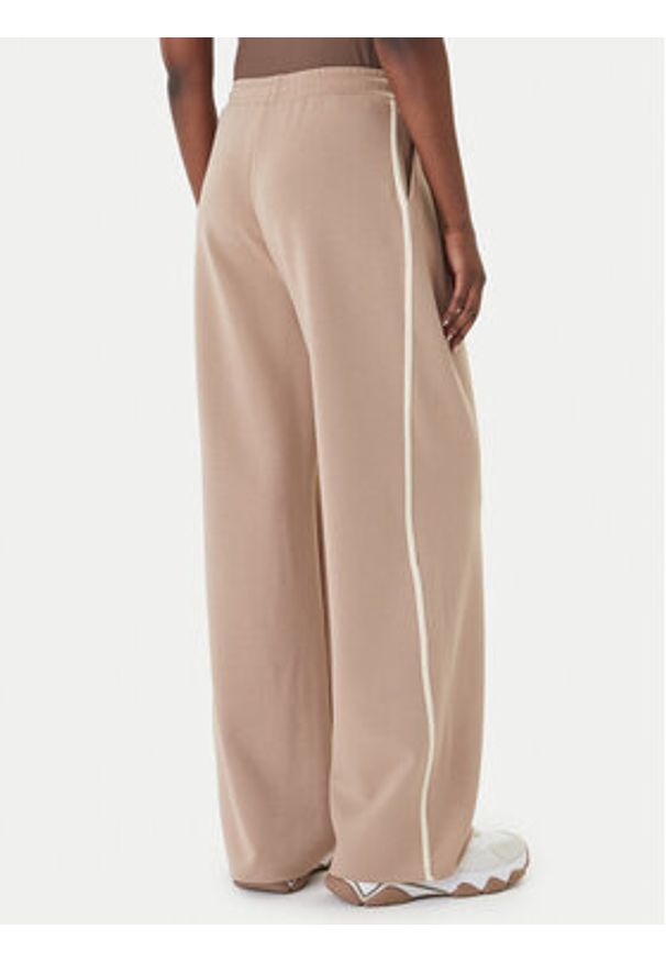 Guess Spodnie dresowe V6GB01 K2914 Beżowy Wide Leg. Kolor: beżowy. Materiał: syntetyk
