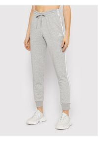 Adidas - adidas Spodnie dresowe Essentials French Terry 3-Stripes GM8735 Szary Slim Fit. Kolor: szary. Materiał: bawełna #1