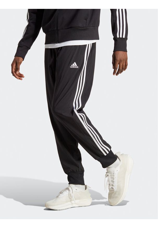 Adidas - adidas Spodnie dresowe AEROREADY Essentials Tapered Cuff Woven 3-Stripes Joggers IC0041 Czarny Regular Fit. Kolor: czarny. Materiał: syntetyk