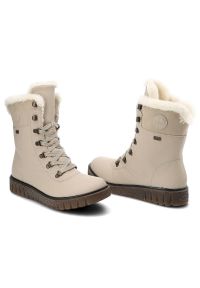 Botki damskie Rieker, cholewka z gładkiej skóry naturalnej z wysoką cholewką i sznurowaniem oraz miękkim obszyciem przy krawędzi gruba podeszwa z wyr. Wysokość cholewki: przed kolano. Kolor: beżowy. Materiał: futro, syntetyk, skóra ekologiczna. Szerokość cholewki: normalna. Wzór: gładki. Obcas: na platformie #2