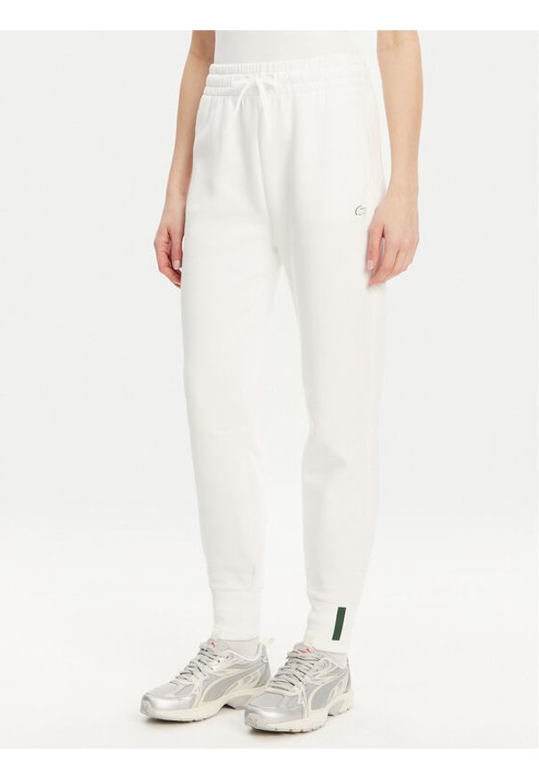 Lacoste Spodnie dresowe XF0343 Biały Regular Fit. Kolor: biały. Materiał: bawełna