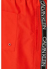 Calvin Klein - Szorty kąpielowe. Kolor: czerwony. Materiał: tkanina, poliester, materiał. Wzór: nadruk #2