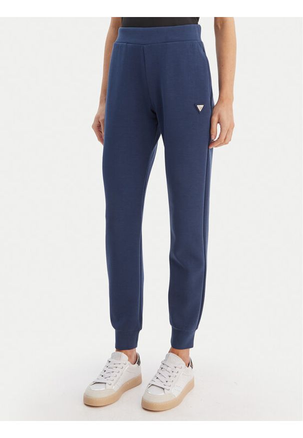 Guess Spodnie dresowe V4YB08 KCAY2 Granatowy Regular Fit. Kolor: niebieski. Materiał: syntetyk