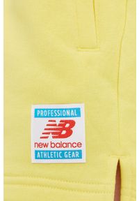 New Balance - Szorty. Okazja: na co dzień. Stan: podwyższony. Kolor: żółty. Wzór: gładki. Styl: casual #4