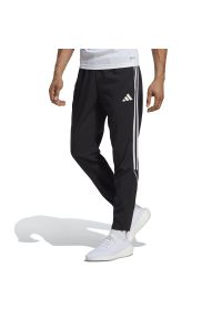 Adidas - Spodnie adidas Tiro 23 League Woven IB5012 - czarne. Kolor: czarny. Materiał: poliester