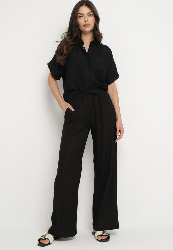 Born2be - Czarne Szerokie Spodnie z Lnem z Gumką w Talii i Kieszeniami Filisela. Okazja: na co dzień, do pracy. Kolor: czarny. Materiał: len. Styl: elegancki, casual