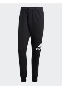 Adidas - adidas Spodnie dresowe Essentials French Terry Tapered Cuff Logo Joggers HA4342 Czarny Regular Fit. Kolor: czarny. Materiał: bawełna