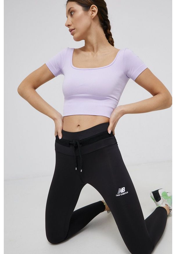 New Balance - Legginsy. Kolor: czarny. Materiał: dzianina. Wzór: gładki