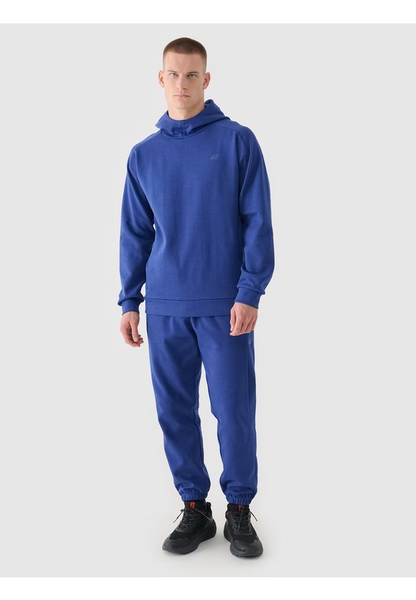 4f - 4F Spodnie dresowe joggery męskie - granatowe L. Kolor: niebieski. Materiał: dresówka. Wzór: ze splotem, gładki. Sport: fitness