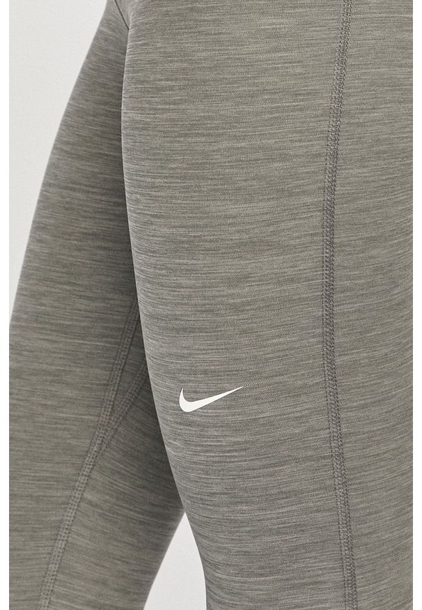 Nike - Legginsy. Kolor: szary. Materiał: tkanina, dzianina, skóra, włókno. Technologia: Dri-Fit (Nike)