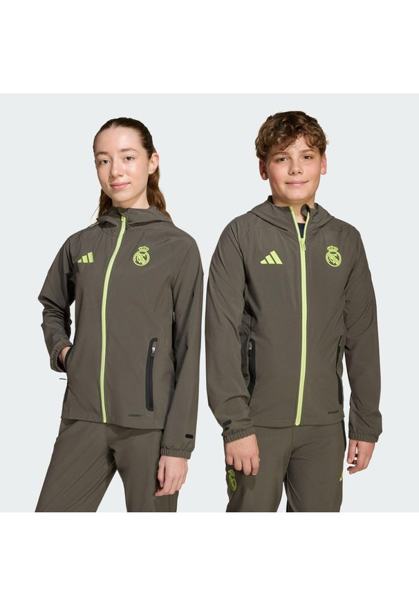 Adidas - Kurtka Real Madrid Tiro 25 Competition Vis Tech Travel Jacket Kids. Kolor: szary, wielokolorowy, żółty. Materiał: dresówka. Sport: piłka nożna