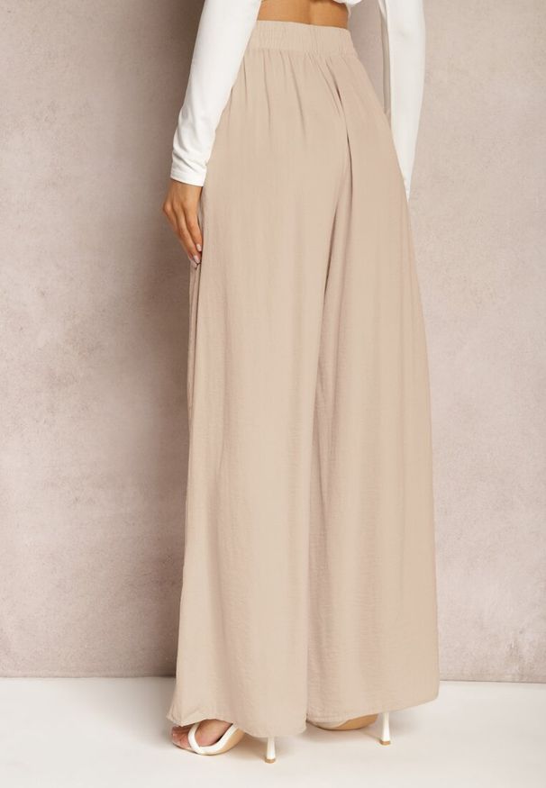 Renee - Beżowe Letnie Spodnie o Szerokim Fasonie z Gumką w Talii Philomen. Kolor: beżowy. Sezon: lato